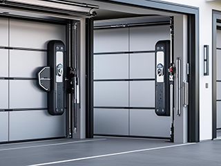 Three modern garage doors with integrated smart technology and security systems in a Shakopee home
