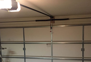 Installed LiftMaster electric garage door opener with safety sensors in Chaska home garage